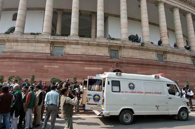 Indian Members of Parliament who were affected by pepper spray are taken to hospital in an ambulance at the Parliament house in New Delhi on February 13, 2014. India's parliament erupted in anarchy February 13 over a bill to create a new state, with angry MPs coming to blows, pulling out a microphone and pepper spraying the chamber, reports said. Ugly clashes also broke out outside the parliament building between supporters of the Telangana state and police, an AFP photographer at the scene said. AFP PHOTO/Prakash SINGH