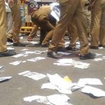 Police_picking up_Posters_as big evidence