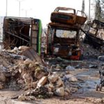An abandoned children’s stroller is seen near damaged vehicles used as barricades in Hanano housing district after government forces took control of the area in Aleppo