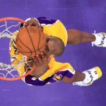 FILE PHOTO: Los Angeles Lakers Bryant slam dunks against the Toronto Raptors during NBA game in Los Angeles