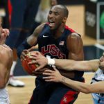 Bryant of the U.S. goes between Argentina’s Ginobili and Argentina’s Campazzo during their men’s preliminary round Group A basketball match at the Basketball Arena during the London 2012 Olympic Games